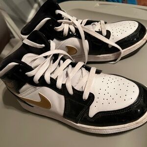 Nike Kids' Black and White Sneakers with Gold Accents